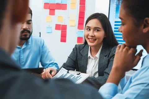 Multiracial analyst team use BI dashboard for data analysis. Concord Stock Photos
