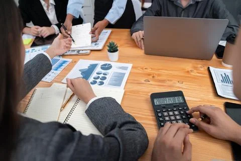 Multiracial analyst team use BI dashboard for data analysis. Concord Stock Photos