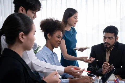 Multiracial analyst team use BI dashboard for data analysis with laptop. Concord Stock Photos