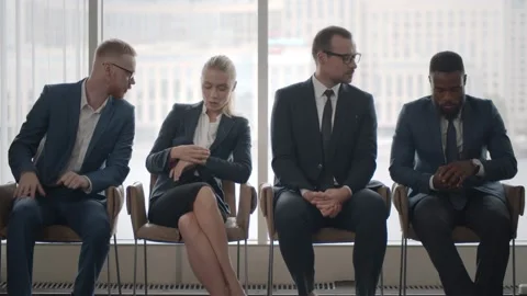 Multiracial applicants getting worried in queue waiting for job interview Video stock 137324720