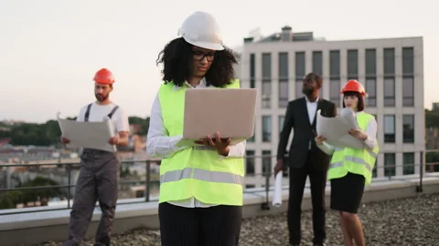 Multiracial architects watching building... | Stock Video | Pond5