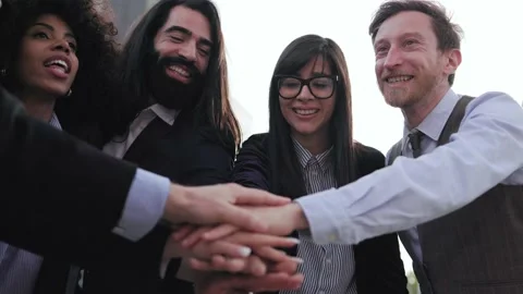 Multiracial business people stacking hands with colleagues outdoor Stock Footage 212970838