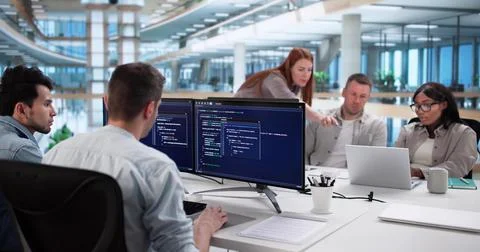 Multiracial Coding Team Developing Software In Modern Business Office Setting 스톡 사진