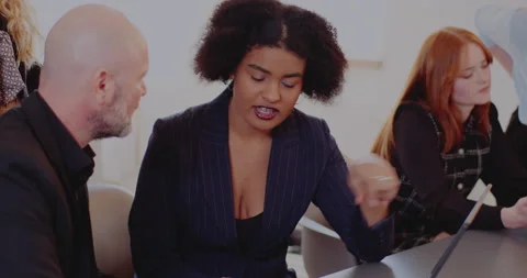 Multiracial colleagues discussing at office Video stock 171573202