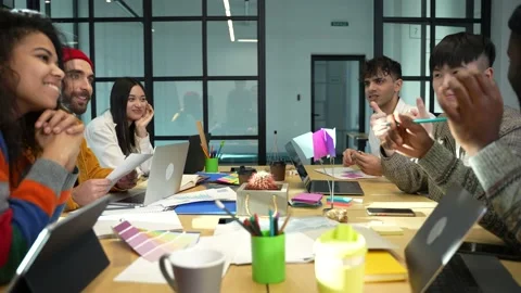 Multiracial colleagues having lively conversation Stock Footage 152343696