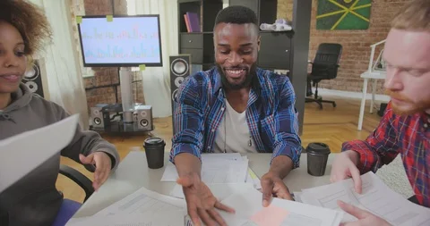Multiracial colleagues rejoice, throw papers and documents fly in air Video stock 114013604