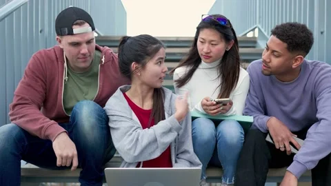 Multiracial college students preparing a group work presentation on laptop. Stock Footage 236797169