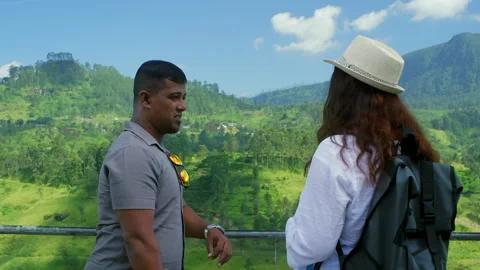 Multiracial couple looking at mountain landscape outdoors, travel lifestyle Stock Footage 328907486