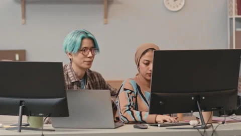 Multiracial Couple of Programmers Coworking in Office Video stock 241272059