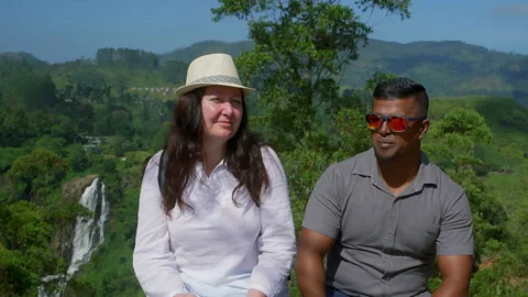 Multiracial couple talking at mountain viewpoint, travel concept Stock Footage 328907489
