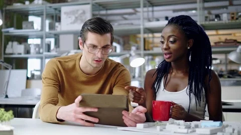 Multiracial couple working in design and engineering architecture office. Stock Footage 85114460