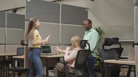 Multiracial coworkers discussing code in office Stock Footage 142536813