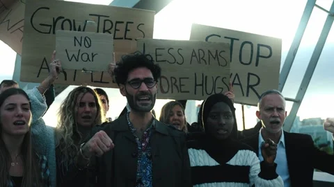 Multiracial diverse ages people protesting against war and violence in the world Stock Footage 261342068