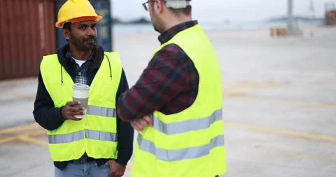 Multiracial engineer men controlling shipping containers inside industrial port Stock Footage 179972209