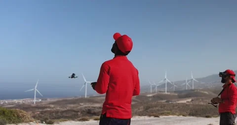 Multiracial engineer men working together on a windmill farm Stock Footage 194266471