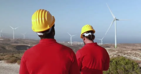 Multiracial engineer men working together on a windmill farm Stock Footage 194267159