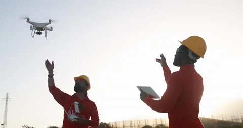 Multiracial engineer men working together on a windmill farm Stock Footage 194267258