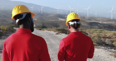 Multiracial engineer men working together on a windmill farm Stock Footage 194267402