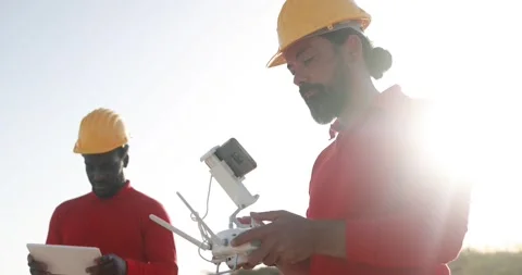 Multiracial engineer men working together on a windmill farm Stock Footage 194267455
