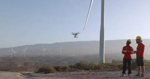 Multiracial engineer men working together on a windmill farm Stock Footage 194267667