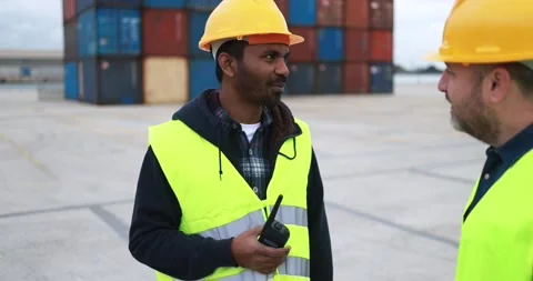 Multiracial engineer people controlling shipping containers Stock Footage 179969116