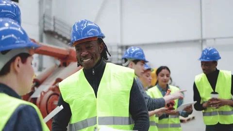 Multiracial engineers working inside automation and robotics facility - Industri Stock Footage 224564740