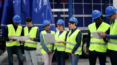 Multiracial engineers working at robotic automation facility - Industrial robot  Stock Footage 231329977