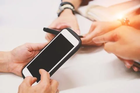 Multiracial friends hand using mobile addicted phone. Wifi connection peopl.. 写真素材