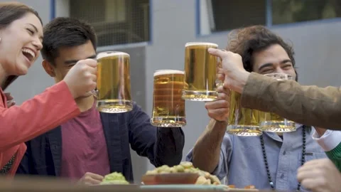 Multiracial friends having fun cheering with beers at brewery bar restaurant Stock Footage 173741203