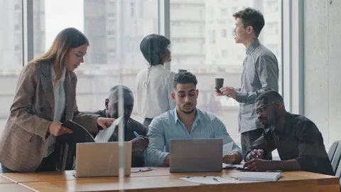 Multiracial group business partner managers in office work talking discussing Stock Footage 156871000