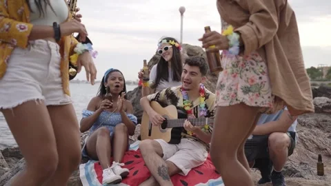 Multiracial group cheerful friends having fun partying on beach at sunset Stock Footage 243084218