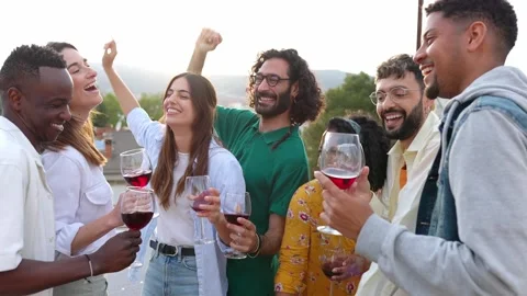 Multiracial group of friends having fun on rooftop party at sunset. Stock Footage 249967952