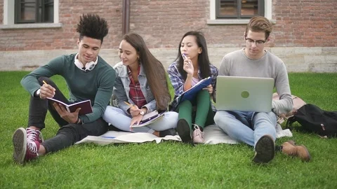 Multiracial group of friends studying together on campus. Stock Footage 101793721