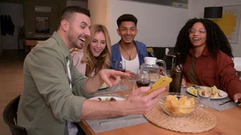 Multiracial group of happy friends having video call diner at home. Smiling Stock Footage 269346268