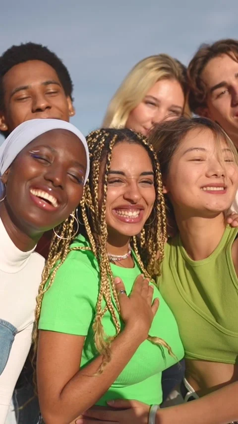 Multiracial group of people smiling taking a selfie outdoors Stock Footage 256586162