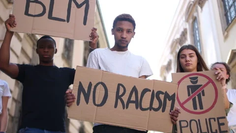A multiracial group of students protests against racism. Boys and girls are Stock Footage 133584378