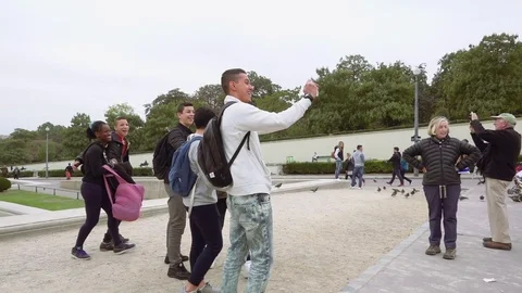 Multiracial group takes selfie with Eiffel Tower Stock Footage 71821401