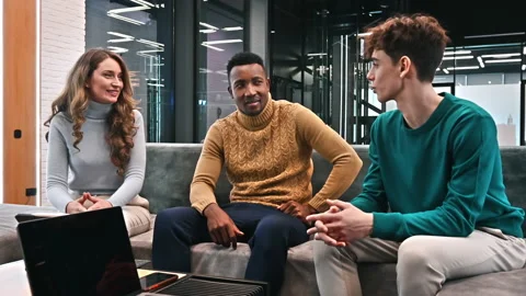 Multiracial group of workers in an office, discussing business affairs with each Stock Footage 235308107