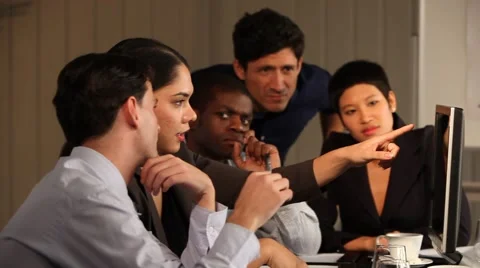 Multiracial group working and looking at screen. Woman leading. Intense. 動画素材 40692436