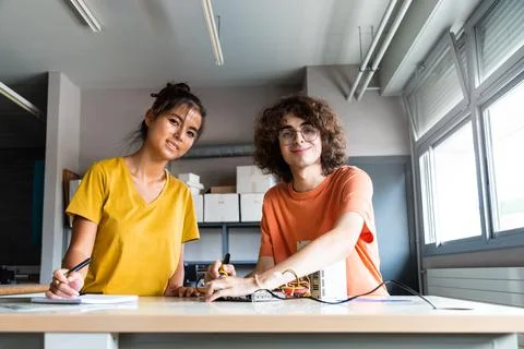 Multiracial high school classmates in electronics class working on a project  Stock Photos