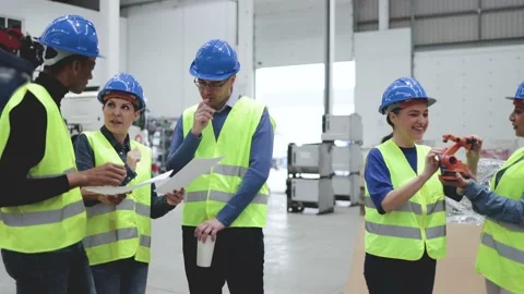 Multiracial industrial engineers working at automated AI robotic factory  Stock Footage 212682485