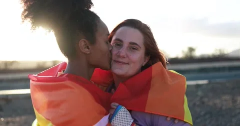 Multiracial lesbian couple having tender moment outdoor Видео 170604780