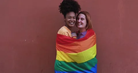 Multiracial lesbian couple smiling on camera - LGBT pride concept Stock Footage 170604307