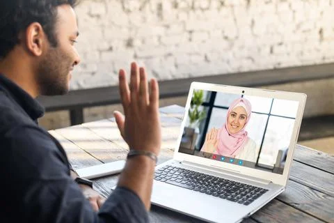 Multiracial man using laptop app for video meeting Stock Photos