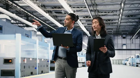 Multiracial management executives in microchip foundry brainstorming Stock Footage 333394877