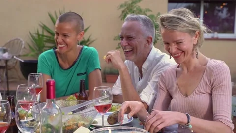 Multiracial middle aged friends eating, celebrating together in summer barbecue Stock Footage 220159706