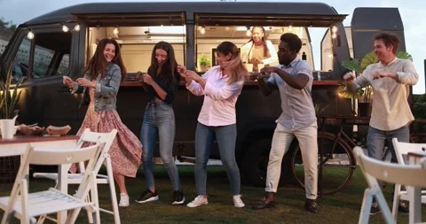 Multiracial people dancing in front of food truck outdoor Stock Footage 156454796