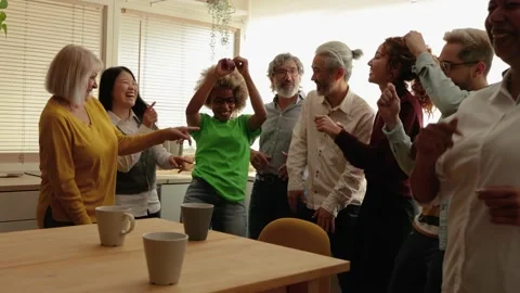 Multiracial people dancing having fun inside home kitchen - Multi-generational Video stock 178588028