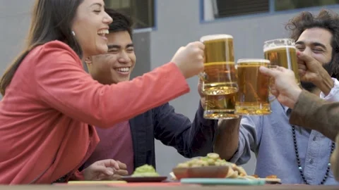 Multiracial people having fun cheering with beer outdoor at brewery pub bar Stock Footage 168250458