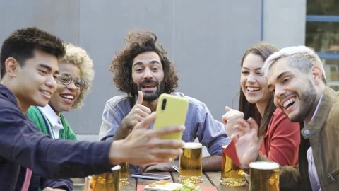 Multiracial people having fun doing video call with friends brewery pub bar Stock Footage 168251140